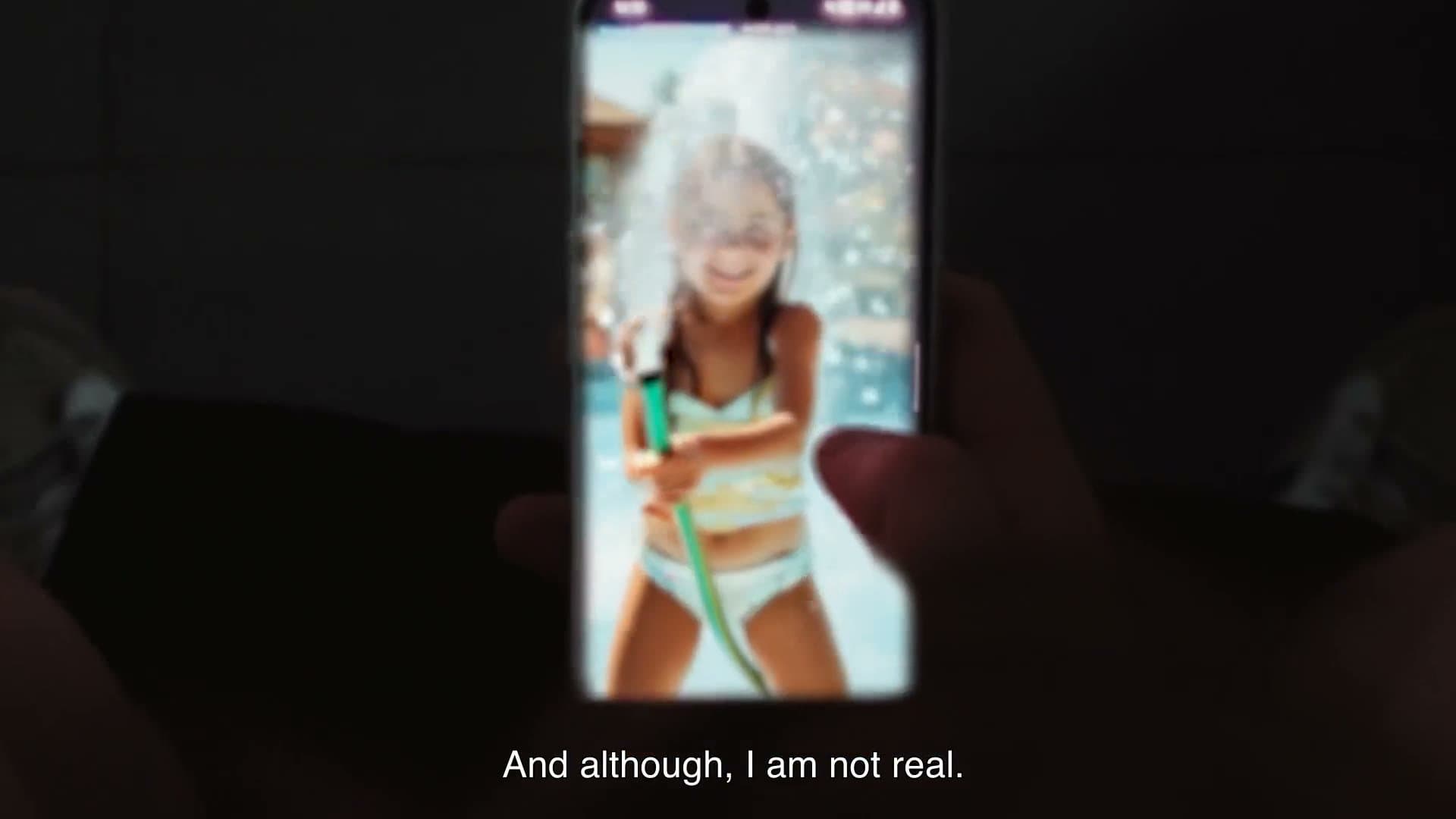 Case video frame: the campaign image on a phone in the dark